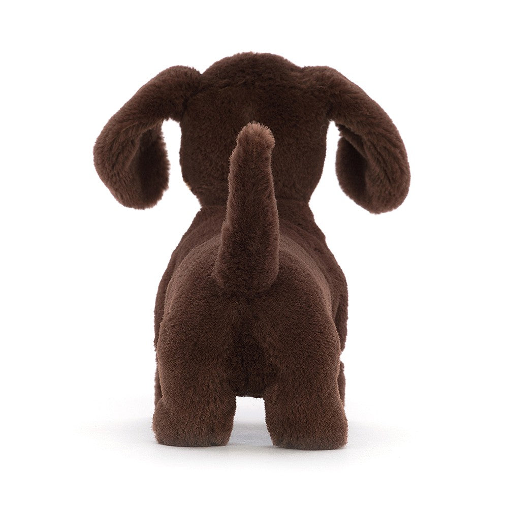 Jellycat Otto Sausage Dog - Small. With soft long ears, a perky tail, golden eyebrows and sassy spirit, bright-eyed Otto's a playful little pup! Say It Baby Gifts. Rear view