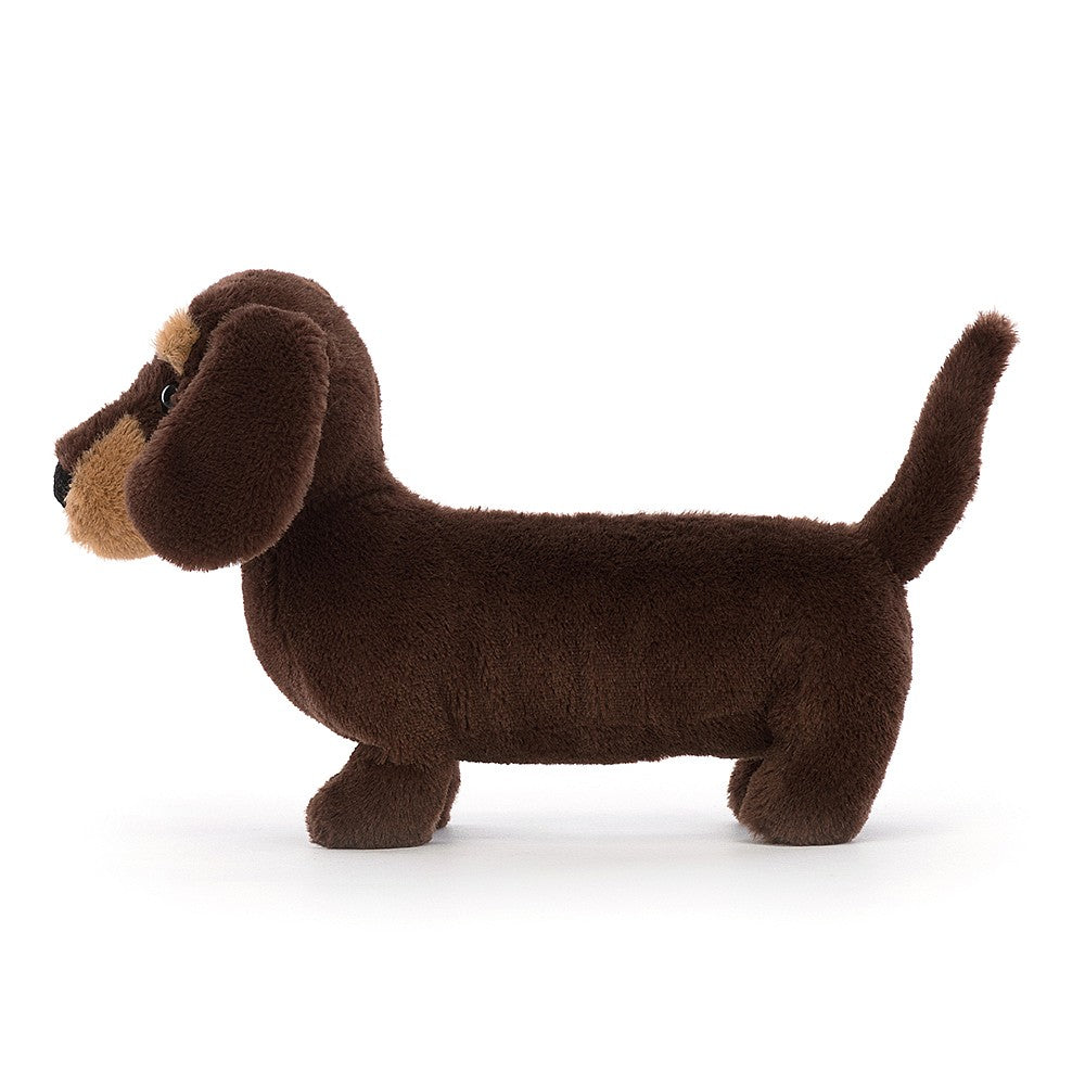 Jellycat Otto Sausage Dog - Small. With soft long ears, a perky tail, golden eyebrows and sassy spirit, bright-eyed Otto's a playful little pup! Say It Baby Gifts. Side View