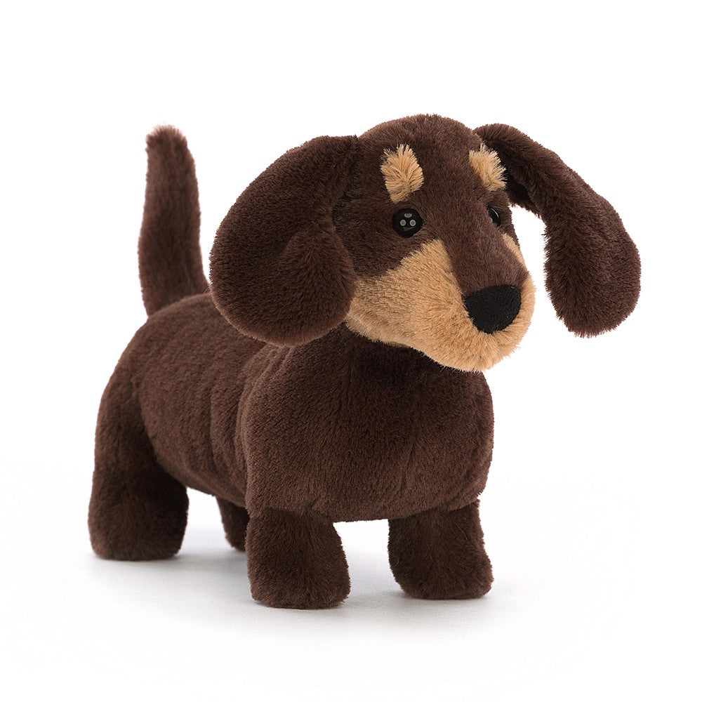 Jellycat Otto Sausage Dog - Small. With soft long ears, a perky tail, golden eyebrows and sassy spirit, bright-eyed Otto's a playful little pup! Say It Baby Gifts. Front View